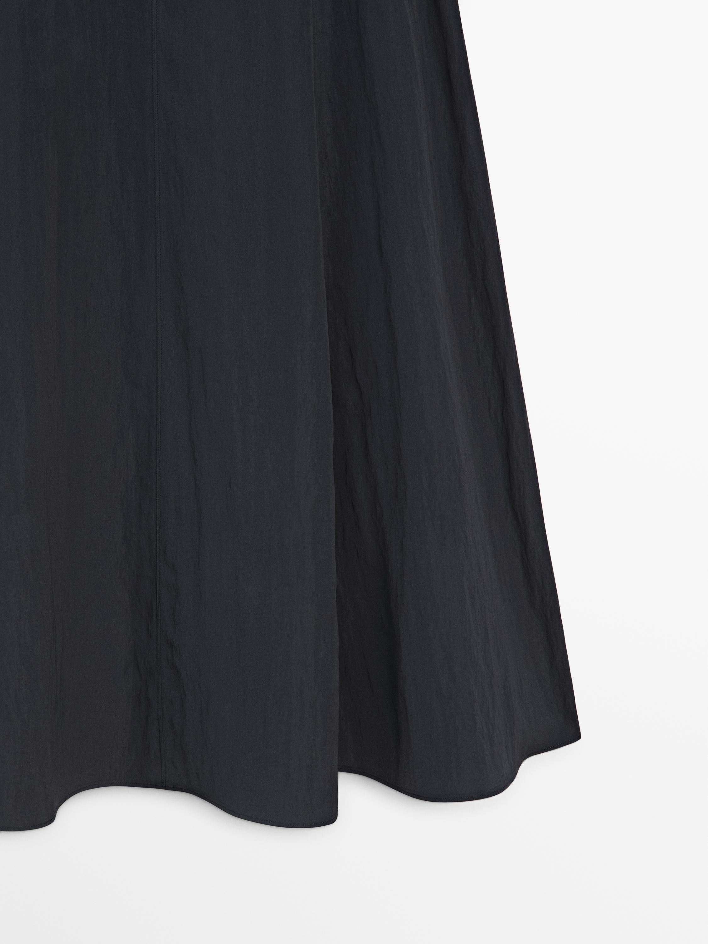 Long skirt with belt detail